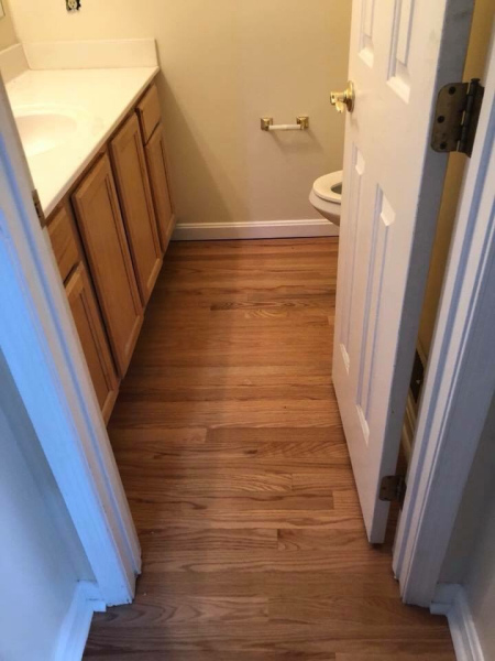 Wood floor installation in bathroom
