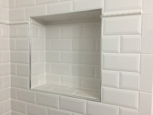 Shower tile shelf